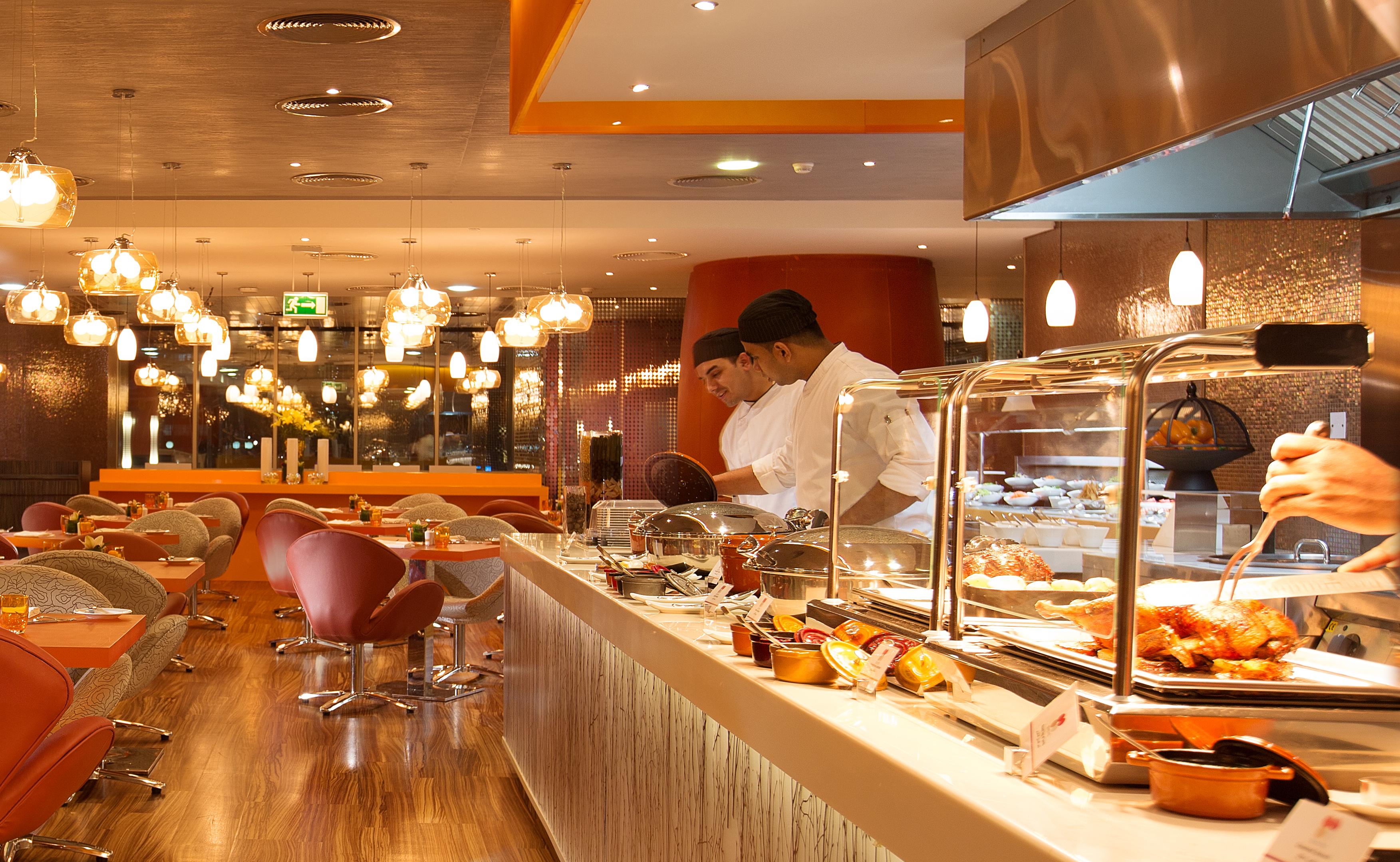 Pullman Dubai Jumeirah Lakes Towers Bagian luar foto A buffet at a restaurant
